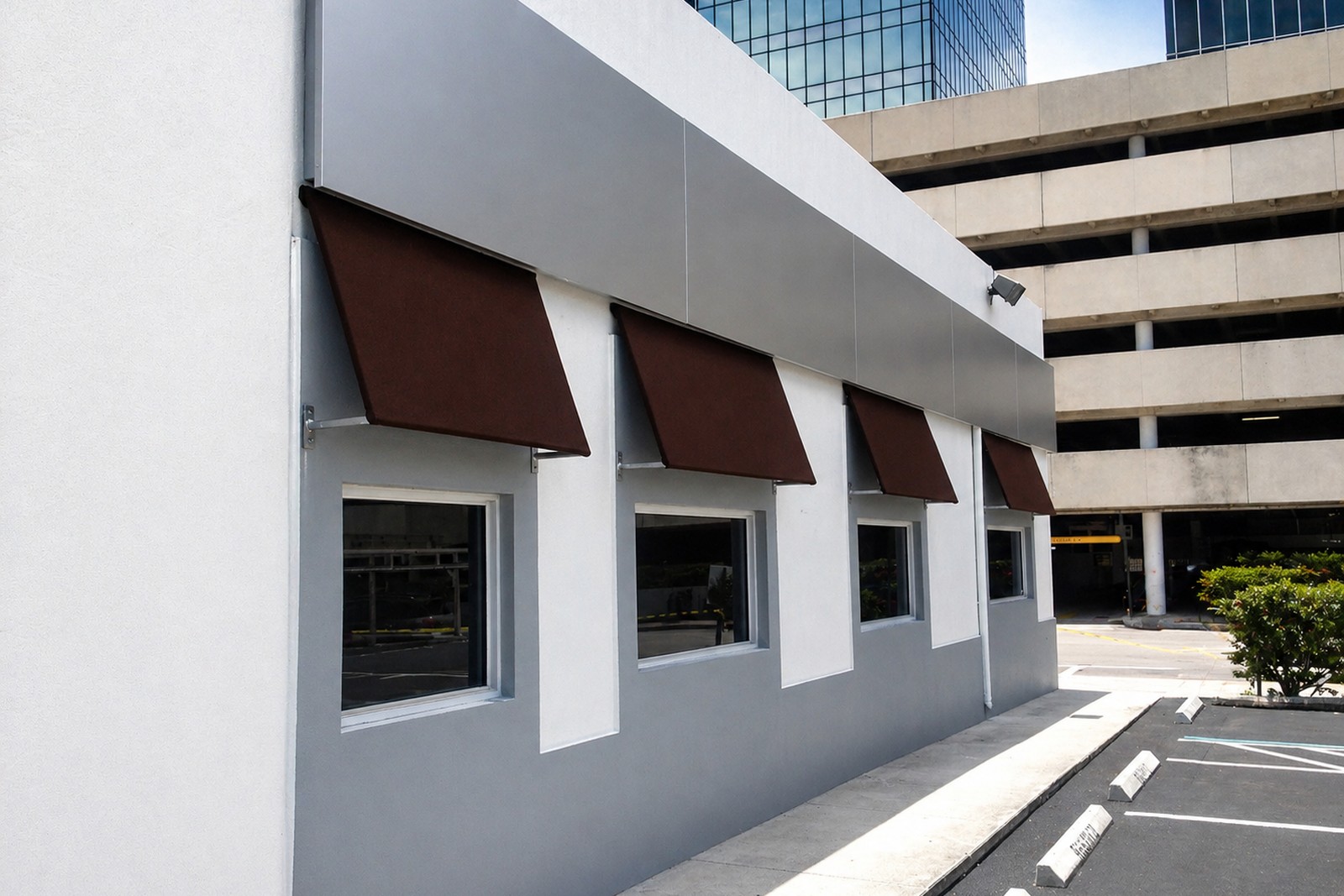 Brown window awnings on a commercial building