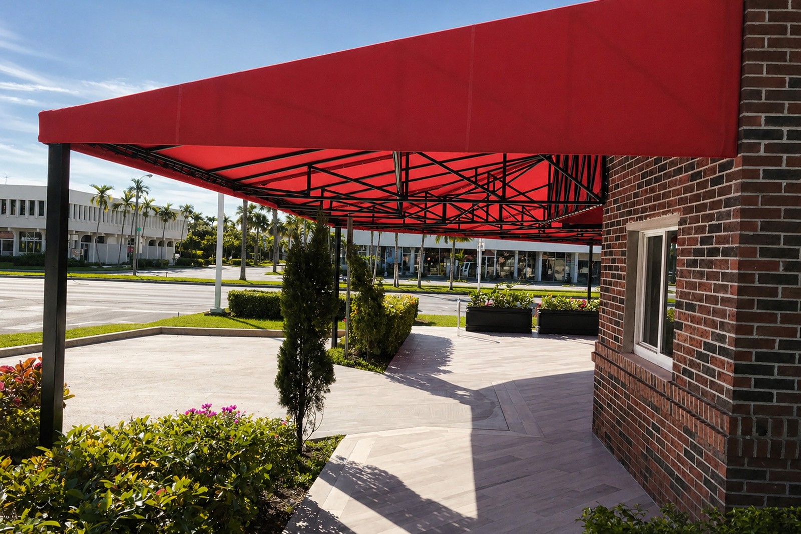Red canopy over a storefront walkway