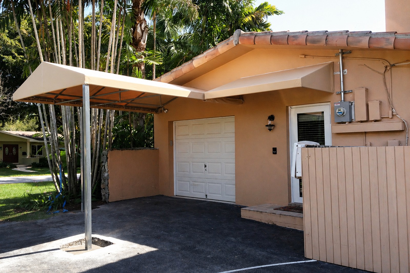 Light-colored canopy over a residential driveway