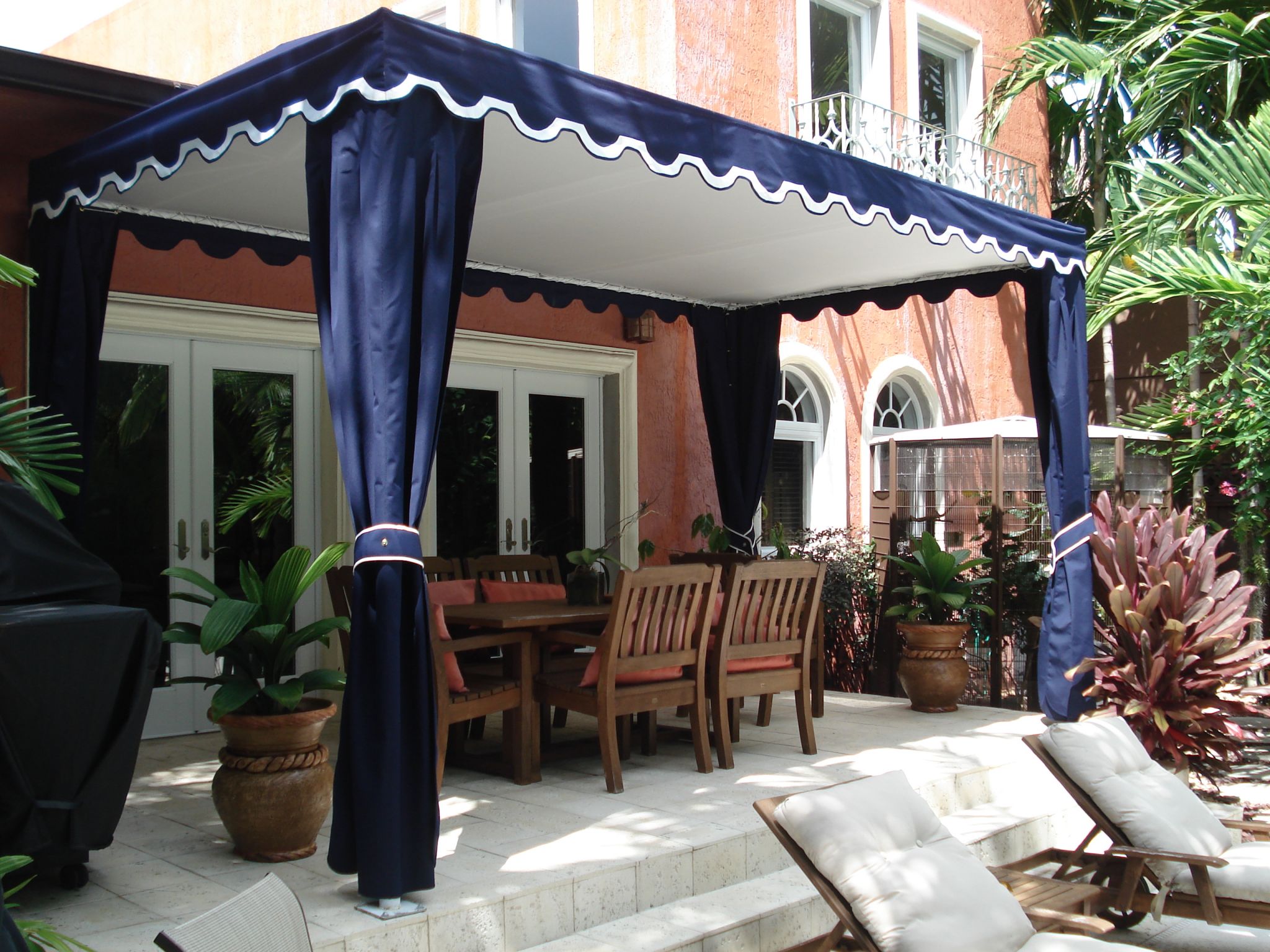 Elegant navy patio canopy — outdoor dining